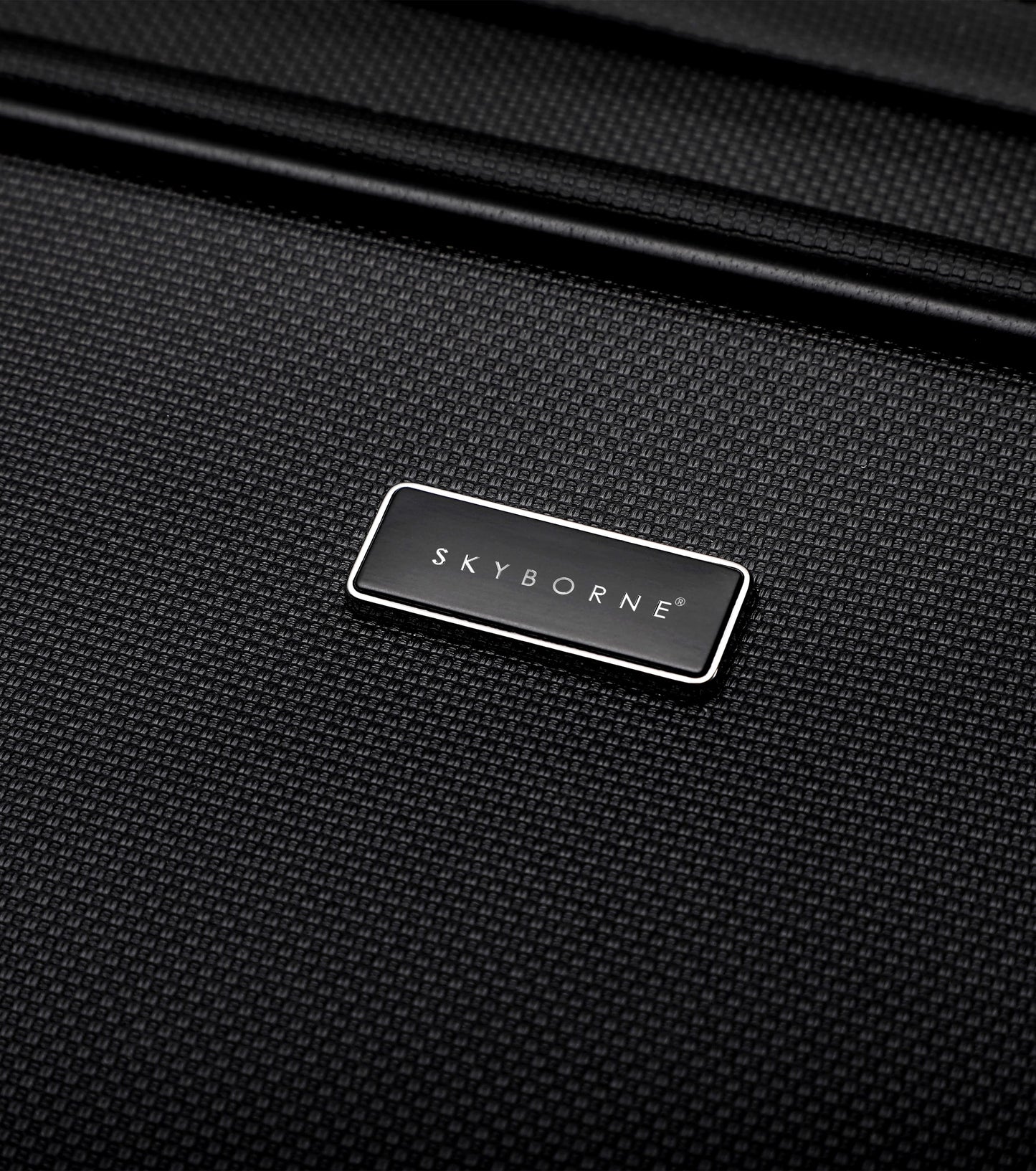 Close-up of a black suitcase with 'Skyborne' logo