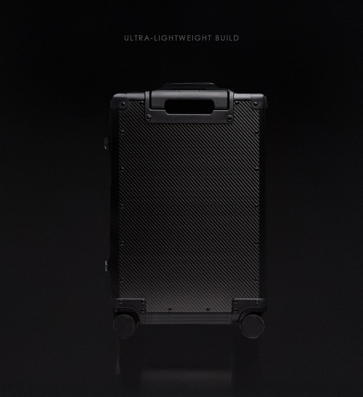 Black suitcase with carbon fiber texture on a black background