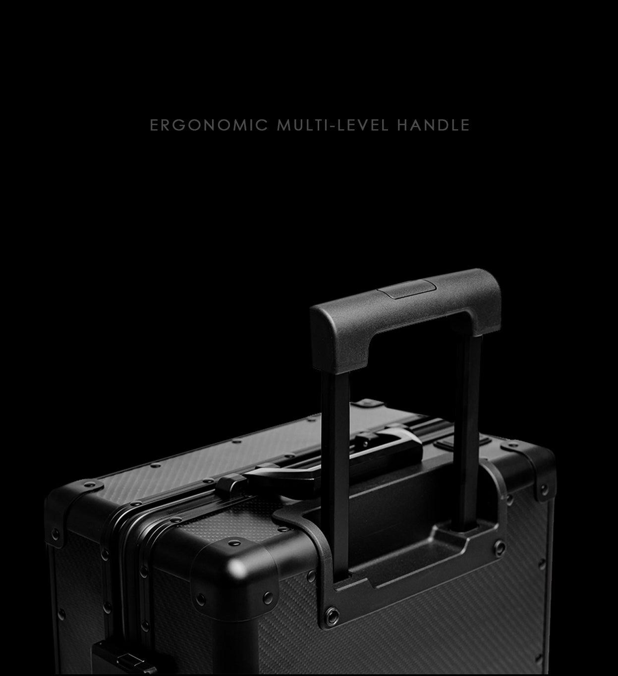 Black suitcase with ergonomic multi-level handle on a black background